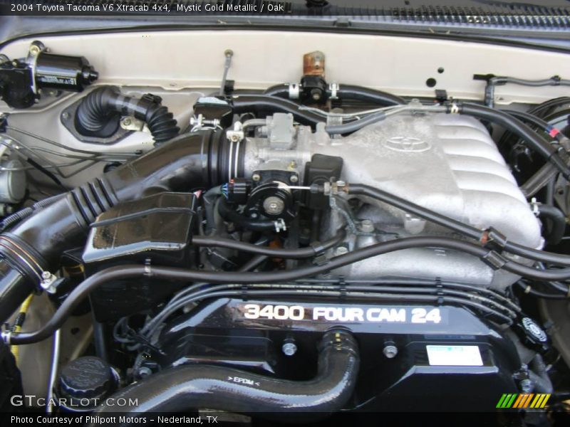 Mystic Gold Metallic / Oak 2004 Toyota Tacoma V6 Xtracab 4x4