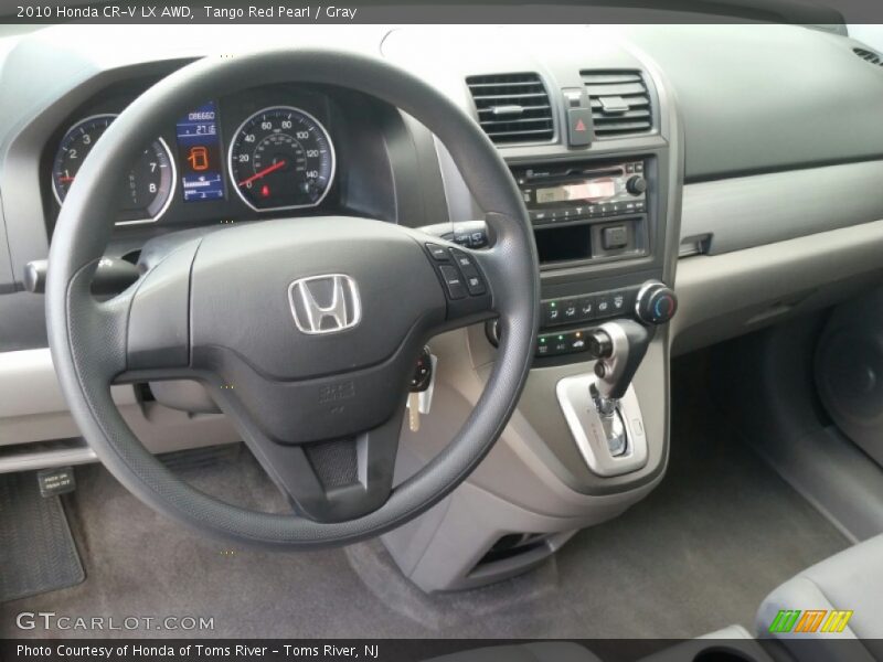 Tango Red Pearl / Gray 2010 Honda CR-V LX AWD
