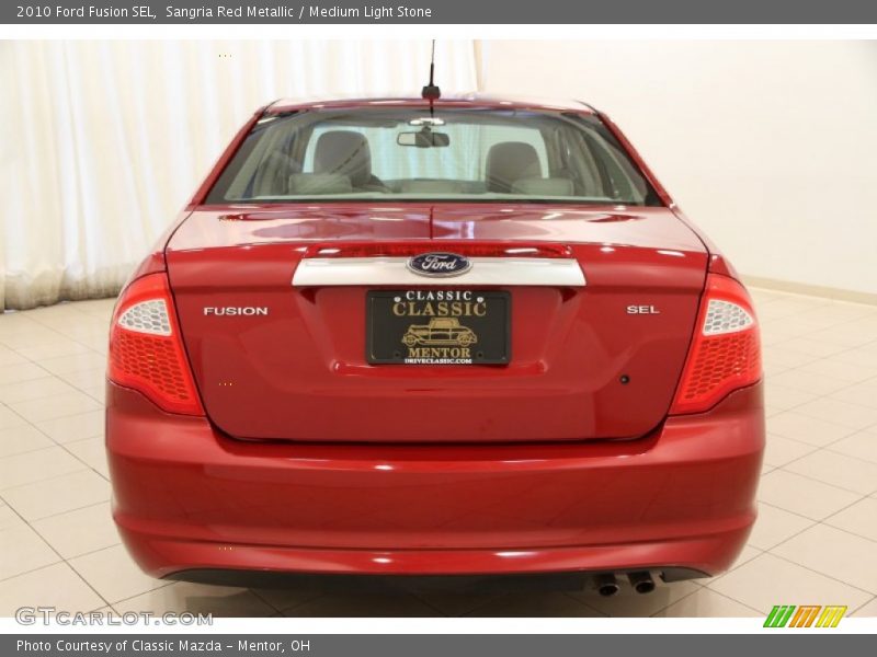 Sangria Red Metallic / Medium Light Stone 2010 Ford Fusion SEL