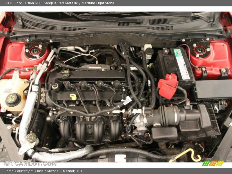Sangria Red Metallic / Medium Light Stone 2010 Ford Fusion SEL