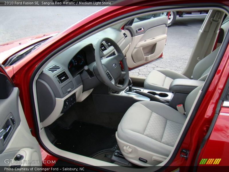 Sangria Red Metallic / Medium Light Stone 2010 Ford Fusion SE