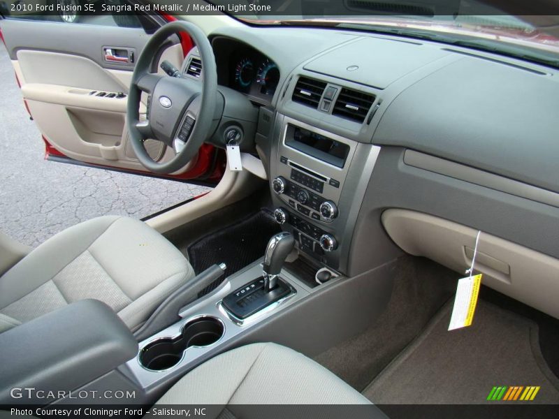 Sangria Red Metallic / Medium Light Stone 2010 Ford Fusion SE
