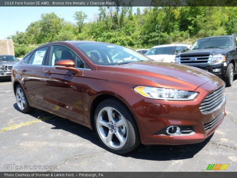 Bronze Fire Metallic / Charcoal Black 2016 Ford Fusion SE AWD
