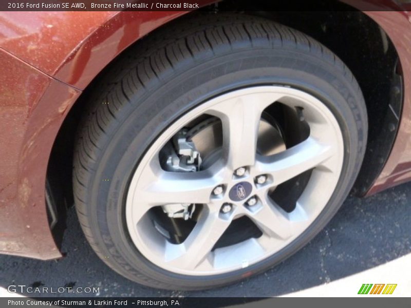 Bronze Fire Metallic / Charcoal Black 2016 Ford Fusion SE AWD