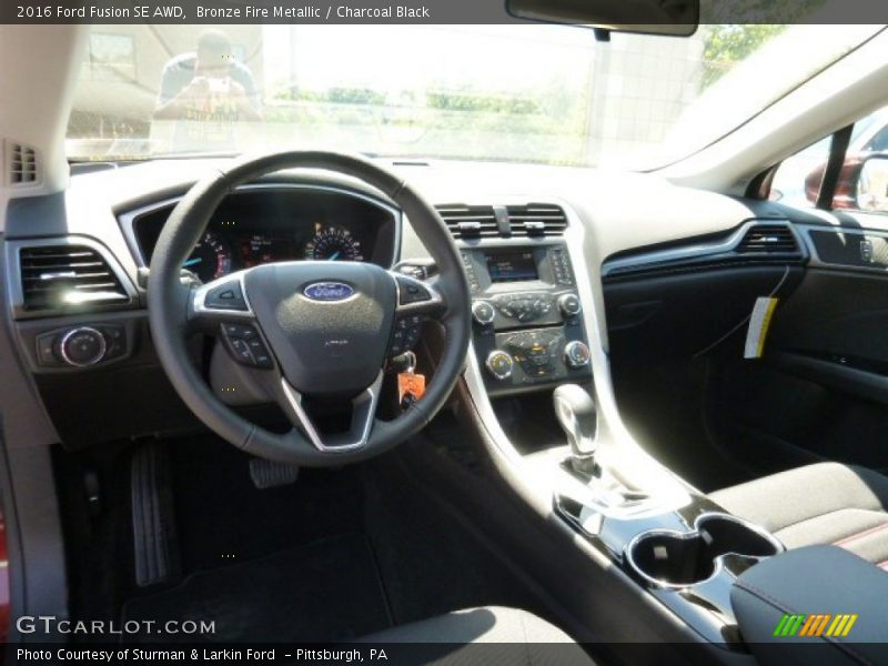 Bronze Fire Metallic / Charcoal Black 2016 Ford Fusion SE AWD