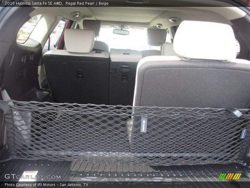 Regal Red Pearl / Beige 2016 Hyundai Santa Fe SE AWD