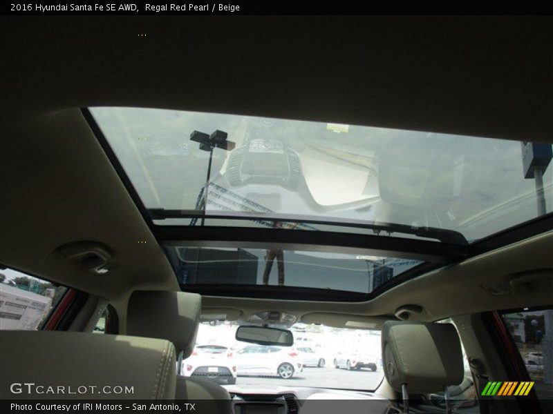 Regal Red Pearl / Beige 2016 Hyundai Santa Fe SE AWD
