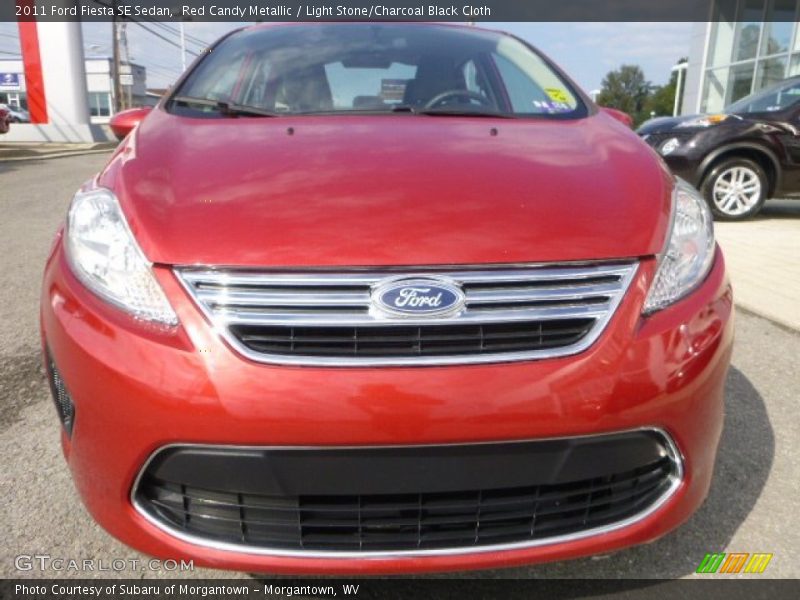 Red Candy Metallic / Light Stone/Charcoal Black Cloth 2011 Ford Fiesta SE Sedan