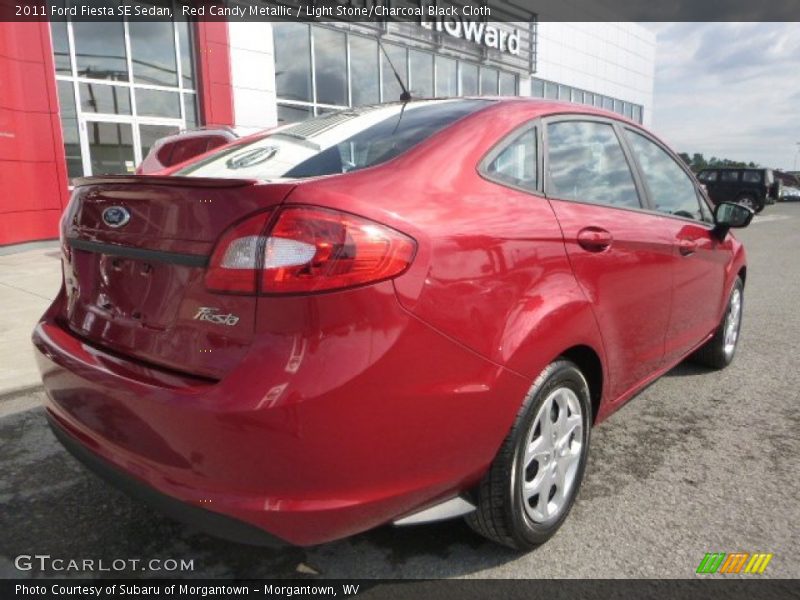 Red Candy Metallic / Light Stone/Charcoal Black Cloth 2011 Ford Fiesta SE Sedan