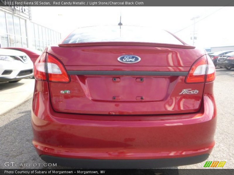 Red Candy Metallic / Light Stone/Charcoal Black Cloth 2011 Ford Fiesta SE Sedan