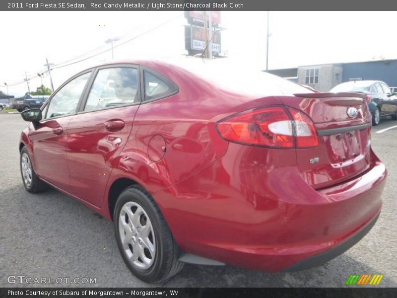 Red Candy Metallic / Light Stone/Charcoal Black Cloth 2011 Ford Fiesta SE Sedan