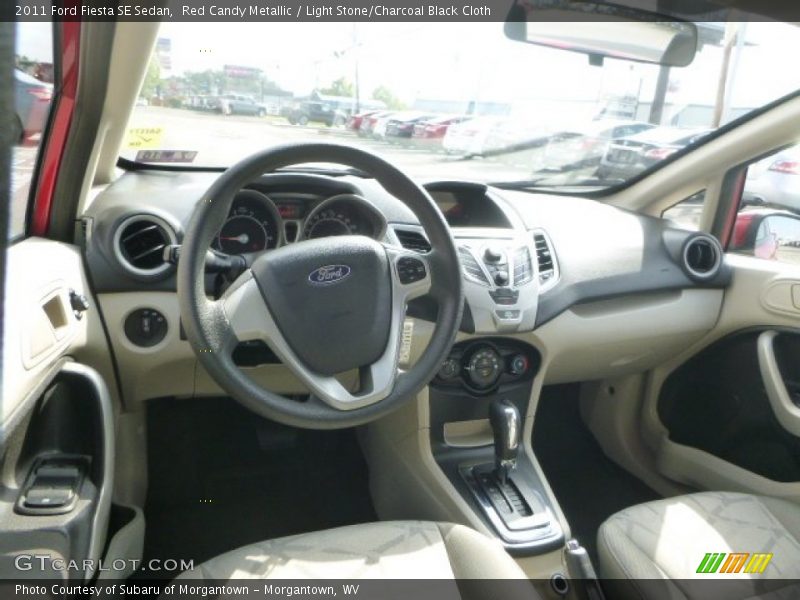Red Candy Metallic / Light Stone/Charcoal Black Cloth 2011 Ford Fiesta SE Sedan