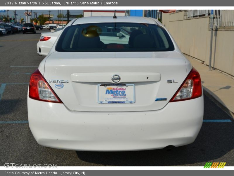 Brilliant Silver Metallic / Charcoal 2012 Nissan Versa 1.6 SL Sedan
