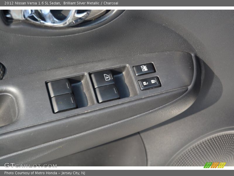 Brilliant Silver Metallic / Charcoal 2012 Nissan Versa 1.6 SL Sedan
