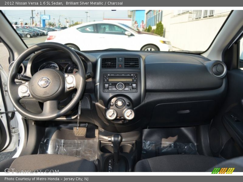 Brilliant Silver Metallic / Charcoal 2012 Nissan Versa 1.6 SL Sedan