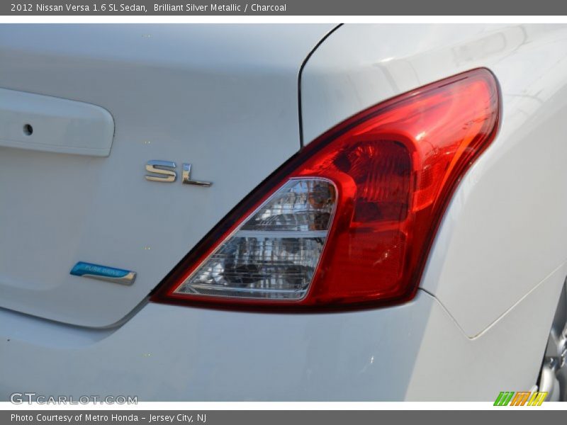Brilliant Silver Metallic / Charcoal 2012 Nissan Versa 1.6 SL Sedan
