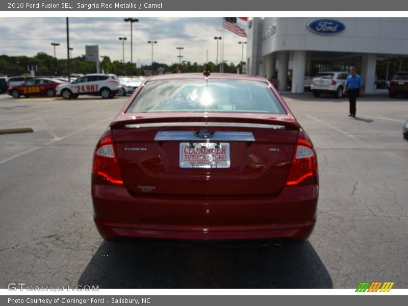 Sangria Red Metallic / Camel 2010 Ford Fusion SEL