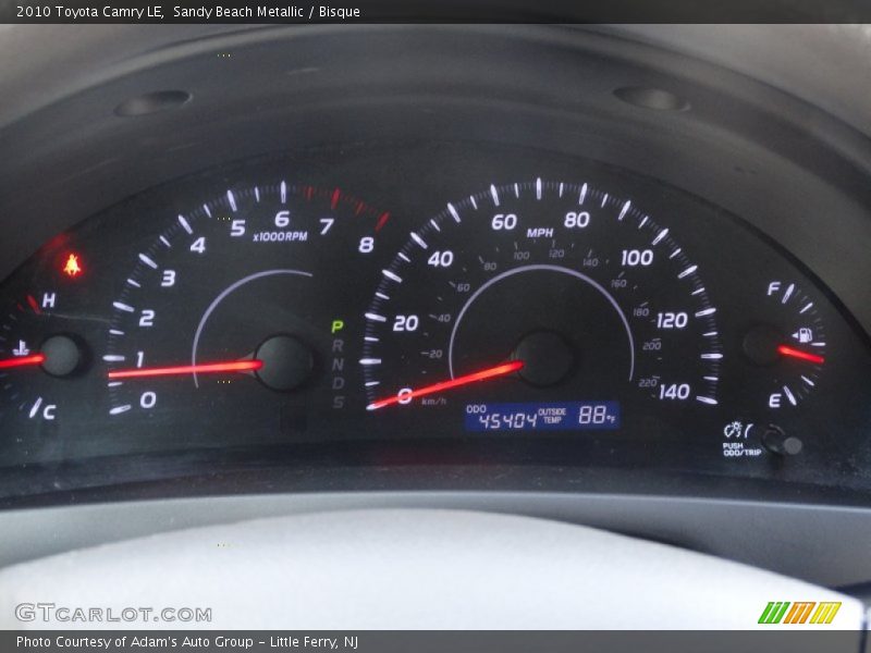 Sandy Beach Metallic / Bisque 2010 Toyota Camry LE