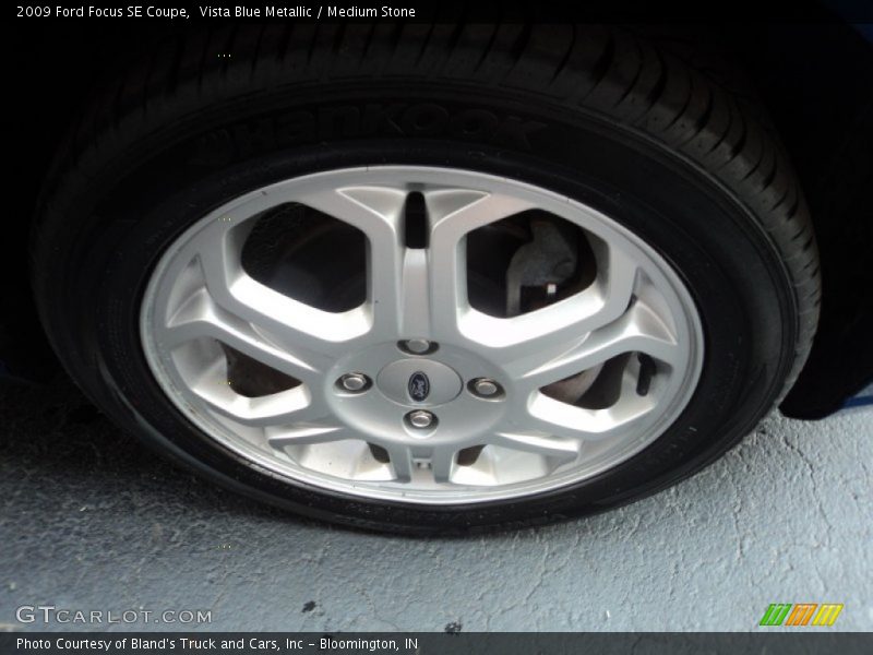 Vista Blue Metallic / Medium Stone 2009 Ford Focus SE Coupe