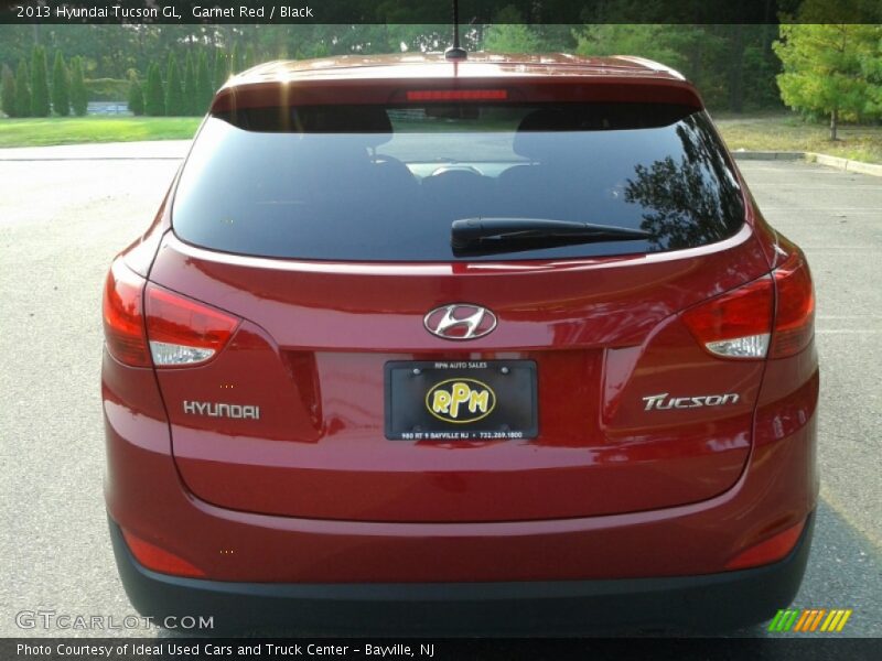 Garnet Red / Black 2013 Hyundai Tucson GL