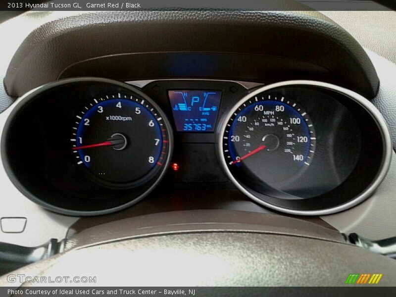 Garnet Red / Black 2013 Hyundai Tucson GL