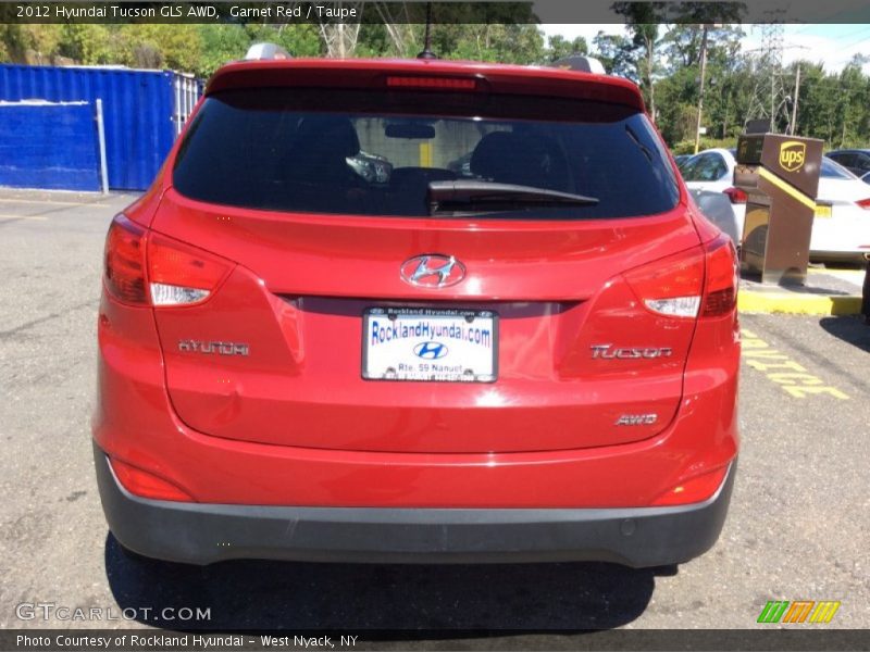Garnet Red / Taupe 2012 Hyundai Tucson GLS AWD