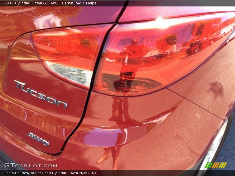 Garnet Red / Taupe 2012 Hyundai Tucson GLS AWD