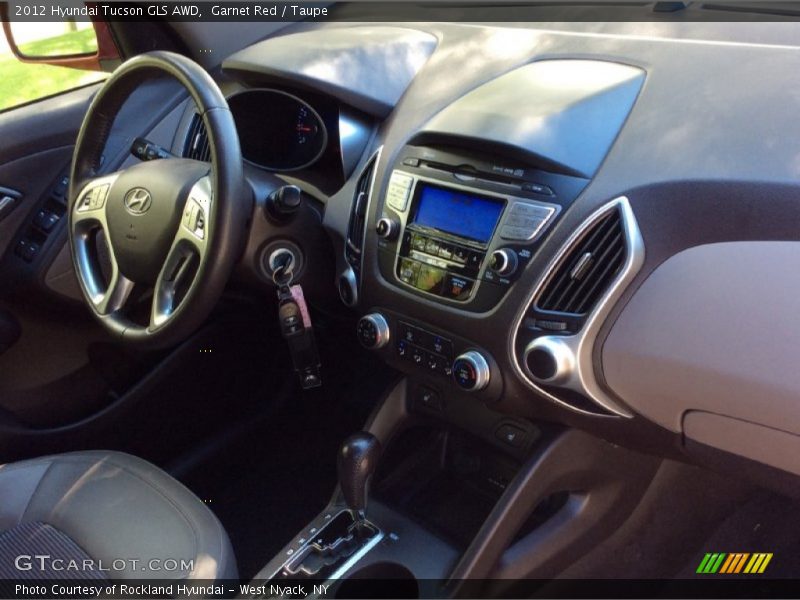 Garnet Red / Taupe 2012 Hyundai Tucson GLS AWD