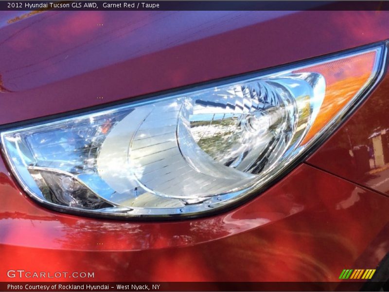 Garnet Red / Taupe 2012 Hyundai Tucson GLS AWD