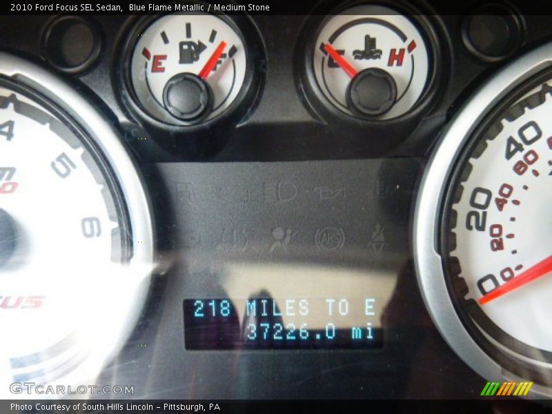 Blue Flame Metallic / Medium Stone 2010 Ford Focus SEL Sedan