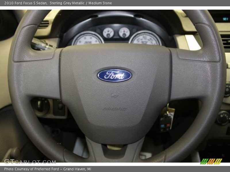 Sterling Grey Metallic / Medium Stone 2010 Ford Focus S Sedan