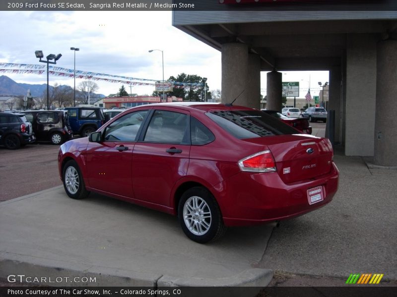 Sangria Red Metallic / Medium Stone 2009 Ford Focus SE Sedan