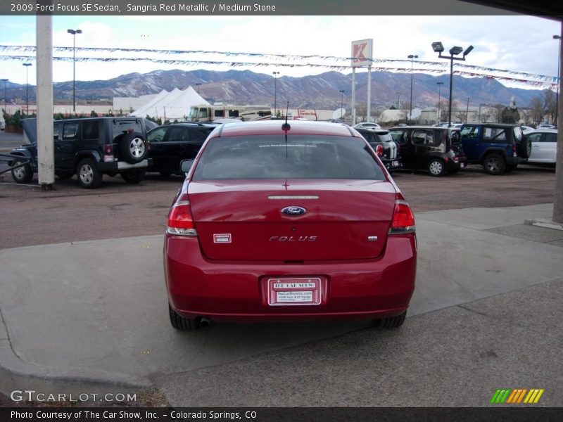 Sangria Red Metallic / Medium Stone 2009 Ford Focus SE Sedan
