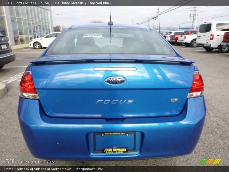 Blue Flame Metallic / Charcoal Black 2010 Ford Focus SE Coupe