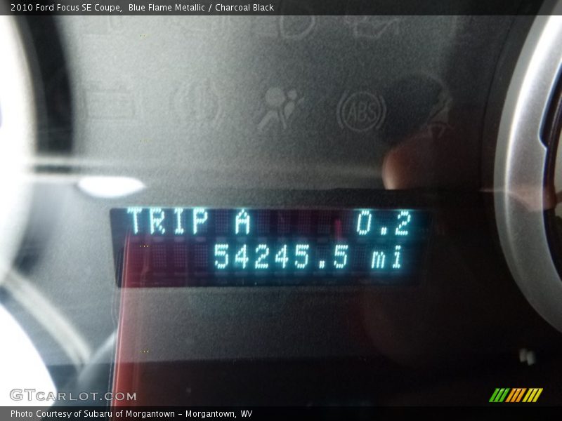 Blue Flame Metallic / Charcoal Black 2010 Ford Focus SE Coupe