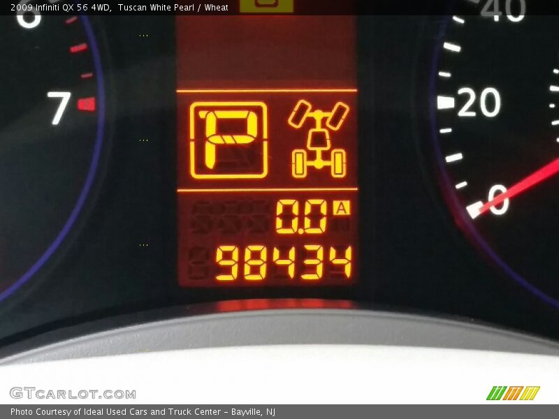 Tuscan White Pearl / Wheat 2009 Infiniti QX 56 4WD