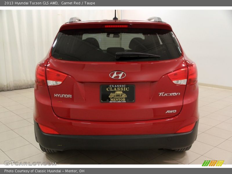 Garnet Red / Taupe 2013 Hyundai Tucson GLS AWD