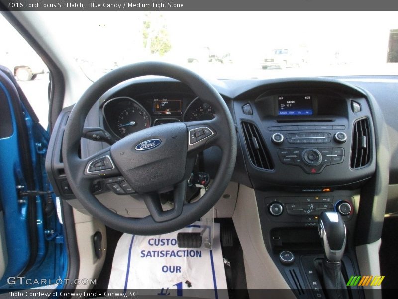 Blue Candy / Medium Light Stone 2016 Ford Focus SE Hatch