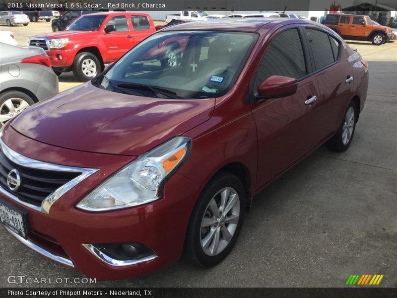 Red Brick / Charcoal 2015 Nissan Versa 1.6 SL Sedan
