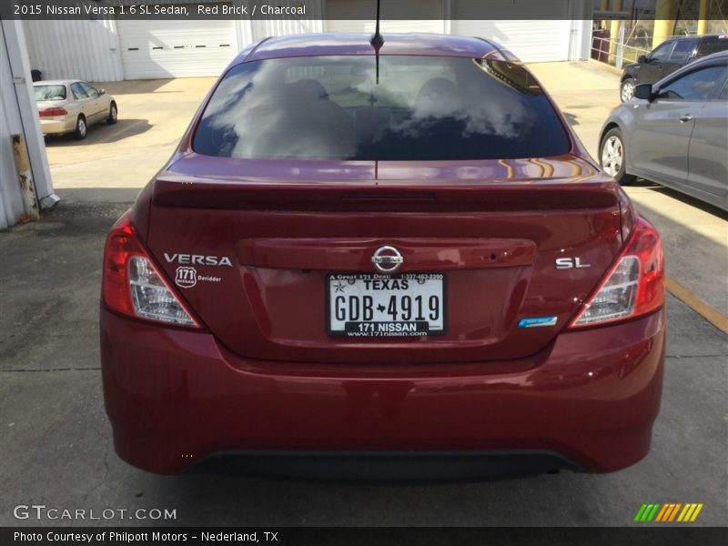 Red Brick / Charcoal 2015 Nissan Versa 1.6 SL Sedan