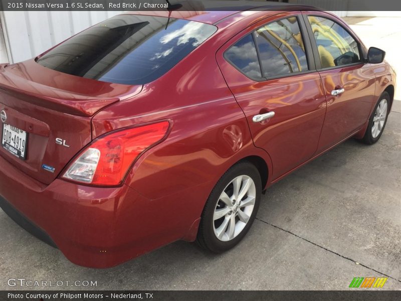Red Brick / Charcoal 2015 Nissan Versa 1.6 SL Sedan