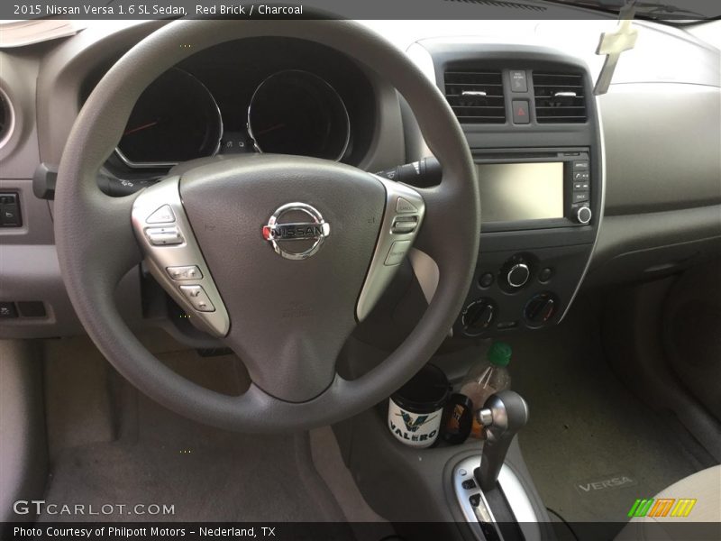 Red Brick / Charcoal 2015 Nissan Versa 1.6 SL Sedan