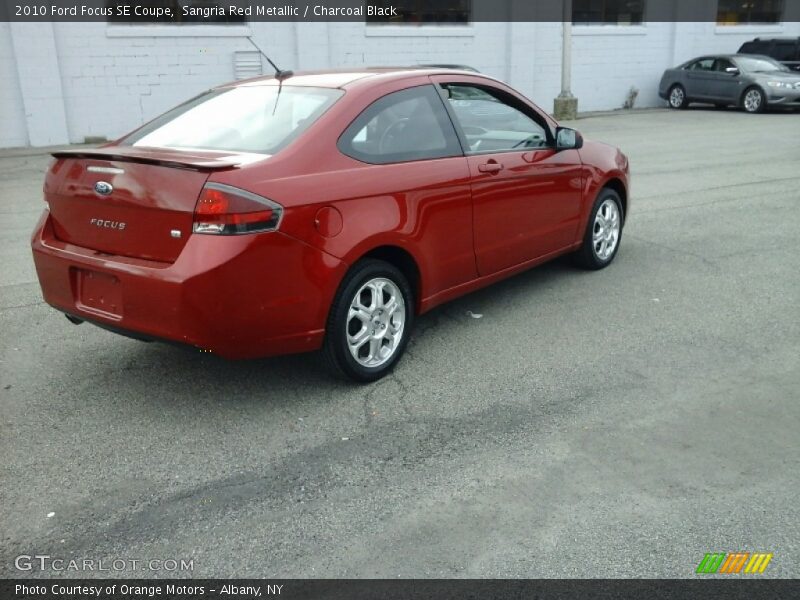Sangria Red Metallic / Charcoal Black 2010 Ford Focus SE Coupe