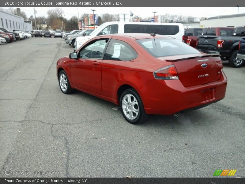 Sangria Red Metallic / Charcoal Black 2010 Ford Focus SE Coupe