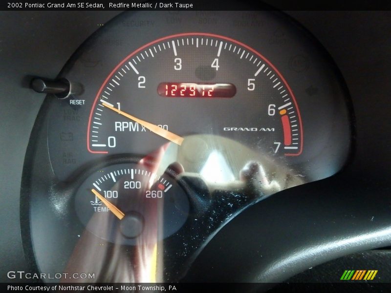 Redfire Metallic / Dark Taupe 2002 Pontiac Grand Am SE Sedan