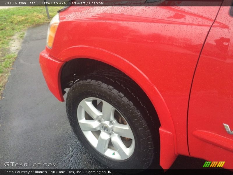 Red Alert / Charcoal 2010 Nissan Titan LE Crew Cab 4x4