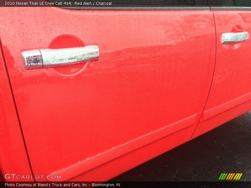 Red Alert / Charcoal 2010 Nissan Titan LE Crew Cab 4x4