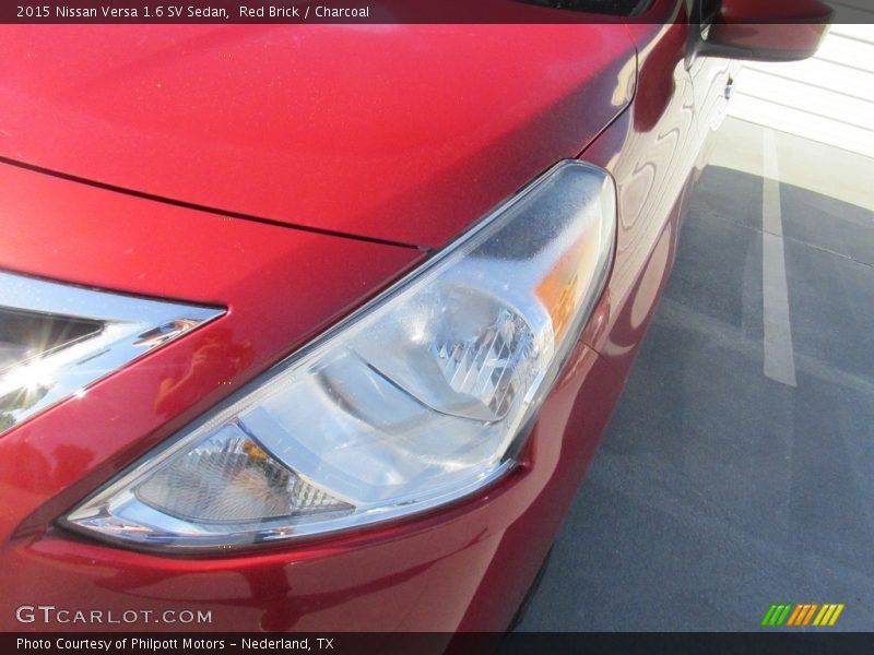 Red Brick / Charcoal 2015 Nissan Versa 1.6 SV Sedan