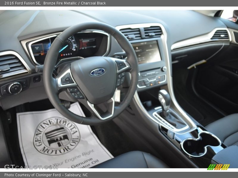 Bronze Fire Metallic / Charcoal Black 2016 Ford Fusion SE