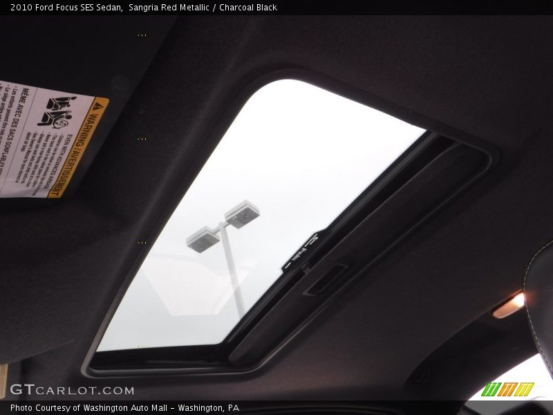 Sangria Red Metallic / Charcoal Black 2010 Ford Focus SES Sedan